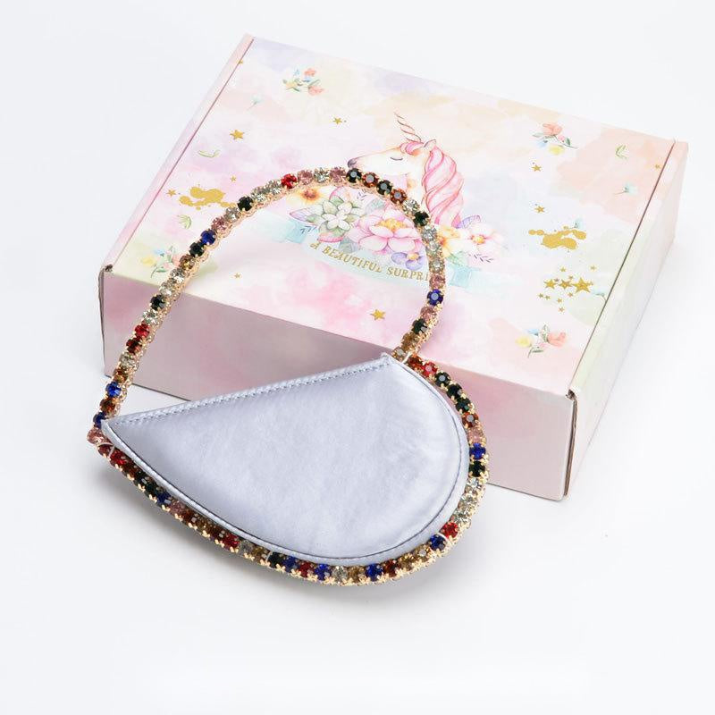 Diamond studded dinner bag with diamond heart-shaped clutch